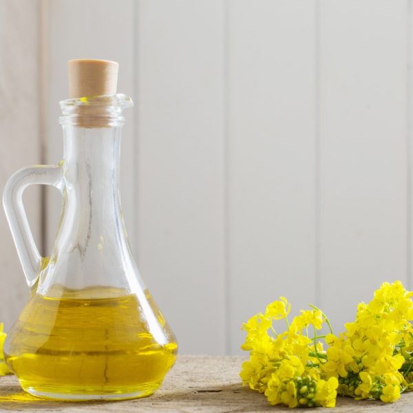 rapeseed-oil-canola-rape-flowers-wooden-table